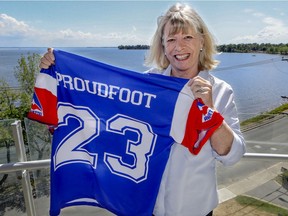Vicki Proudfoot with her late husband Tony's Montreal Alouettes jersey at her home in Pointe-Claire, west of Montreal, on June 19, 2020.