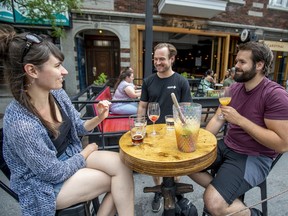 Pub West Shefford co-owner Maxime Rousseau speaks to customers on the terrasse of his resto-bar on Mont-Royal Ave. on Thursday June 25, 2020.