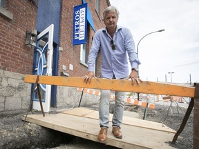 Ted Dranias in front of the front entrance of his restaurant, Petros, located on Williams St. on Saturday, June 27, 2020. Dranias delayed the opening of his restaurant last year because of construction on William St. Now, just as he is opening his restaurant after the pandemic shutdown, the city has torn up the sidewalks in front of his restaurant.