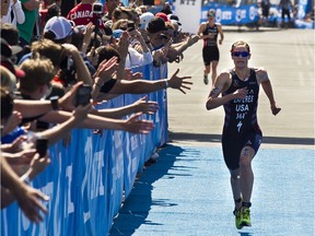 Women ITU World Triathlon Series   standings leader Katie Zaferes heads to the finish line alone to win the Montreal International Triathlon in Old Montreal on June 28, 2019. Zaferes finished the 750-metre swim, 20-kilometre cycle and five-kilometre run in 58 minutes 15 seconds for her fourth victory of the season. She crossed the finish line 11 seconds ahead of Georgia Taylor-Brown (background).