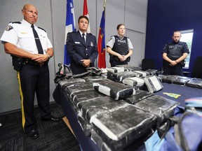 RCMP Inspector Jacques Rainville, left, Alain Surprenant, in charge of intelligence for Quebec region at the Canada Border Services Agency, and RCMP Cpl. Geneviève Byrne at press conference at the RCMP detachment in Valleyfield, west of Montreal Tuesday September 18, 2018 to publicize the seizure of 81 kilos of cocaine.
