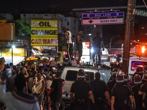 People dance on top of a car during a protest on June 6, 2020 in the Brooklyn borough in New York City. This is the 12th day of protests since George Floyd died in Minneapolis police custody on May 25.