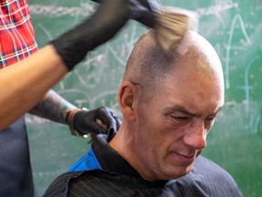 Emmanuelle Bolduc gave free haircuts to the underprivileged at Saint Columba House, a community centre run by the United Church, in Montreal on Wednesday December 18, 2019. 55-year-old Michel Hebert sits for a free cut. Dave Sidaway / Montreal Gazette ORG XMIT: 63665