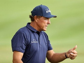Phil Mickelson of the United States reacts after making a putt for birdie on the 18th green during the second round of the Travelers Championship at TPC River Highlands on Friday, June 26, 2020, in Cromwell, Conn.