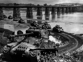 Sherman tanks of B Squadron, Lord Strathcona's Horse, grind a path up the bank of the Imjin River in 1952, during the Korean War. Almost 27,000 Canadians served in the Korean War, which began on June 25, 1950.