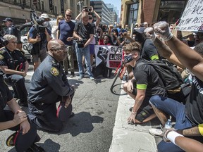 Toronto Police Chief Mark Saunders kneels on Toronto's Yonge Street  with March For Change rally marchers in support and remembrance of George Floyd who was killed by police in Minneapolis , Friday June 5, 2020. [Peter J Thompson] [For National story by TBA/National]