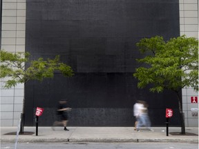 The Apple Store on Ste-Catherine St. appears to make a statement while covering their flagship storefront windows ahead of a planned march against police brutality. The plywood protecting the windows took the shape of a large black square, a symbol used in support of the Black Lives Matter movement in Montreal, on Saturday, June 6, 2020.