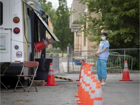 A health care worker waits to greet people at a mobile COVID-19 testing site in LaSalle June 6, 2020.