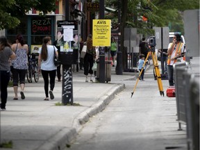 Signs announcing the Mont-Royal will be turned in to a pedestrian mall are seen in Montreal, on Wednesday, June 10, 2020. (Allen McInnis / MONTREAL GAZETTE) ORG XMIT: 64569