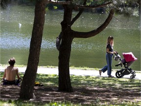 Karine Lemay takes advantages of a quiet, but very windy day to walk with her daughter, Victoria-Rose Kobrynsky, in Parc Lafontaine in Montreal, on Thursday, June 11, 2020. (Allen McInnis / MONTREAL GAZETTE)