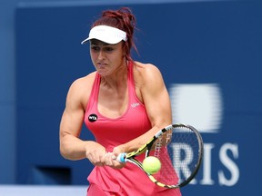 Gabriela Dabrowski of Canada plays a shot against Flavia Pennetta of Italy during Day 1 of the Rogers Cup at the Aviva Centre on August 10, 2015 in Toronto, Ontario, Canada.