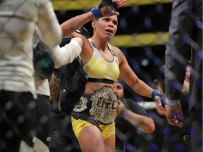 Amanda Nunes celebrates victory over Miesha Tate during the UFC 200 event at T-Mobile Arena on July 9, 2016 in Las Vegas, Nevada.