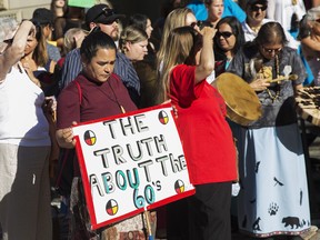 Sixties Scoop survivors and supporters gather for a demonstration at a Toronto courthouse on Aug. 23, 2016.