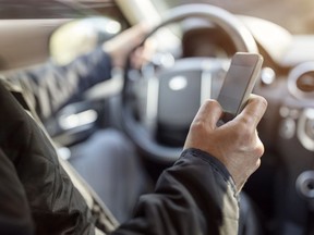 A dozen police officers carried out a blitz of inspections on Highways 13, 20 and 40 Monday, snagging 29 drivers for using their cellphone behind the wheel.