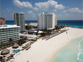 Aerial view of an almost empty beach in Cancun, Quintana Roo state, Mexico, on March 28, 2020. A significant drop in the number of tourists is registered in Mexico's resorts due to the novel coronavirus pandemic.