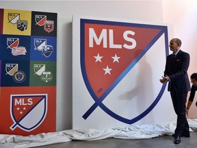 In this file photo taken on Sept. 18, 2014 Major League Soccer (MLS) commissioner Don Garber unveils the MLS logo during an event in New York.