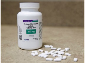 (FILES) In this file photo taken on May 20, 2020 a bottle and pills of Hydroxychloroquine sit on a counter at Rock Canyon Pharmacy in Provo, Utah. - The World Health Organization announced on June 3, 2020 that clinical trials of the drug hydroxychloroquine will resume as it searches for potential coronavirus treatments. On May 25, the WHO announced it had temporarily suspended the trials to conduct a safety review, which has now concluded there is "no reason" to change the way the trials are conducted. The UN health agency's decision came after a study published in The Lancet medical journal suggesting the drug could increase the risk of death among COVID-19 patients. (Photo by GEORGE FREY / AFP) (Photo by GEORGE FREY/AFP via Getty Images)