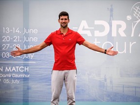 Novak Djokovic hastested positive for coronavirus on June 23, 2020 along with Grigor Dimitrov, Borna Coric and Viktor Troicki, after taking part in an exhibition tennis tournament in the Balkans. (Photo by Andrej ISAKOVIC / AFP)