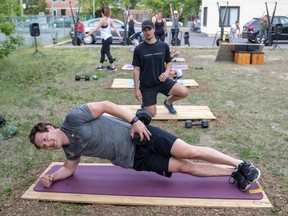 Sean Coulton watches over client Ken Matheson in a Uniti Fitness class in Pointe-Claire. “Almost every single member responded yes” when Coulton asked if they were comfortable returning to a group exercise environment.