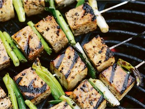 Genevieve Taylor adds green onions to the skewers in her recipe for pepper and soy tofu.
