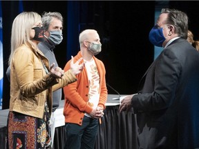 Quebec Premier François Legault chats with Sophie Prégent, president of the Union des artistes, Luc Fortin, president of the Quebec Musicians Guild and Yannick Nézet-Séguin, Conductor of the Orchestre Métropolitain following a news conference in Montreal, on Monday, June 1, 2020.