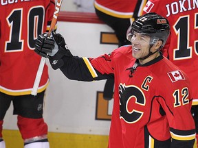 Calgary Flames Jarome Iginla celebrates after scoring his 500th career goal, against the Minnesota Wild, making him the 42nd player in league history to hit that milestone, in Calgary, on Jan. 7, 2012.