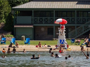 People swim at the beach in Parc Jean-Drapeau in 2014.