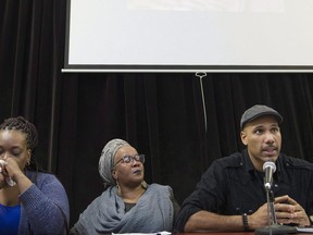 Johanne Coriolan, left, a family member of Pierre Coriolan and activists Wil Prosper, right, and Maguy Metellus attend a news conference in Montreal, Wednesday, Feb. 7, 2018. In the throes of a mental health crisis, Pierre Coriolan, 58, died after police opened fire after using a taser and shooting rubber bullets to try to subdue him. They also used their batons and a taser again after the gunshots were fired.