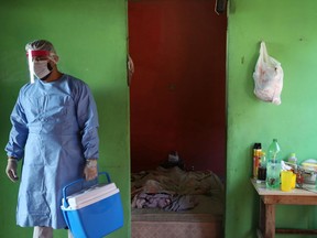 Municipal health worker Mauro Pereira Rodrigues is seen after taking samples from Francisco Maia da Silva, who died at the age of 75 after reporting symptoms consistent with COVID-19, during the coronavirus disease (COVID-19) outbreak in Manaus, Brazil, May 27, 2020. REUTERS/Bruno Kelly