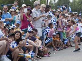 Crowds line Sherbrooke Street at the annual Fête nationale parade in Montreal on Monday, June 24, 2013.