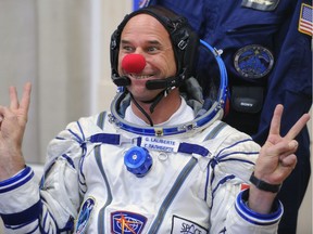 Canadian space tourist and founder of Cirque du Soleil Guy Laliberte jokes during space suit testing prior to his blast off from a Russian-leased Kazakh Baikonur cosmodrome on September 30, 2009 in a Russian Soyuz TMA-16 rocket.