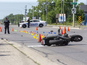 Police investigate a motorcycle accident in London, Ont., on June 17, 2020.