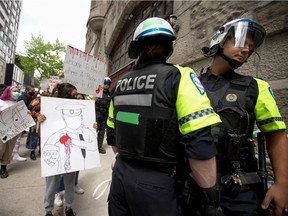 Protesters confront police during a demonstration in Montreal on June 7 in the aftermath of George Floyd's killing by officers in Minneapolis.