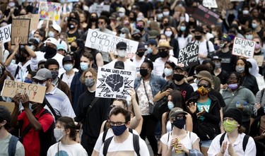 Thousands of people take part in march against racism and police brutality in Montreal on Sunday, June 7, 2020.