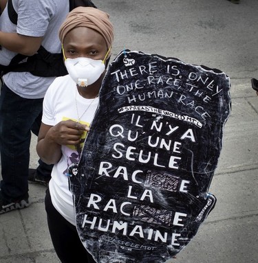 Sign of the times at march against racism and police brutality in Montreal on Sunday, June 7, 2020.