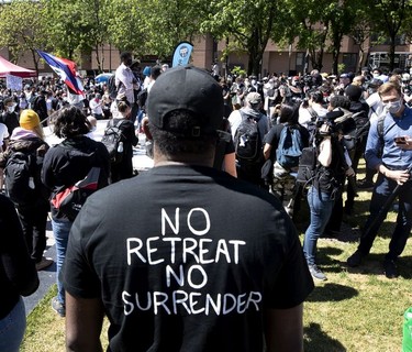 People gather to listen to speeches before the start of march against racism and policy brutality in Montreal on Sunday, June 7, 2020.