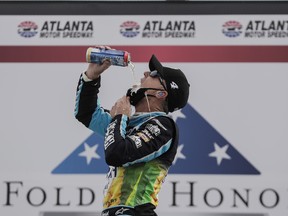 NASCAR Cup Series driver Kevin Harvick (4) celebrates winning the Folds of Honor Quik Trip 500 at Atlanta Motor Speedway.