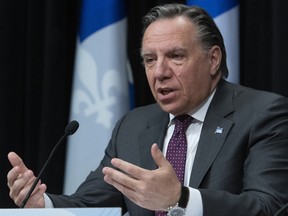 Quebec Premier François Legault announces his intention to re-open primary schools during a news conference on the COVID-19 pandemic, Monday, April 27, 2020 at the legislature in Quebec City.