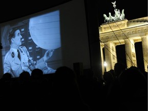 An open-air screening of The Great Dictator in Berlin in 2011. Luckily, writes Joe Schwarcz, modern technology allows us to watch Charlie Chaplin’s films without having to go to the theatre — or gather in large groups.
