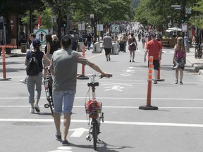 Mont-Royal Ave.’s lively new pedestrian zone was filled with people on June 24, but on a street traditionally festooned with Quebec flags on Fête nationale, only a small one was in sight, Josh Freed writes.