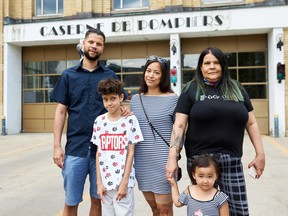 From left to right: Clifton Patrick Glaves, his son Nine, Clifton's friend Marie Ty and his mother Marsha Akparook with her grandaughter. Glaves, Ty and Akparook were part of a group that rang the fire alarm and warned residents when they saw a fire in a Saint-Henri condo building on June 16.