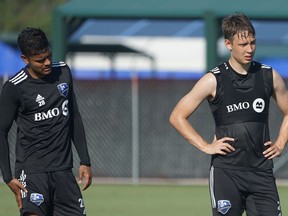 Montreal Impact midfielders Shamit Shome, left, and Lassi Lappalainen take part in training camp for the MLS Is Back tournament in Orlando, Fla., on Monday.