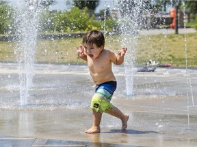 Maxim Black plays at the splash pad on St. Joseph Blvd. in Lachine on Thursday. So far this year, the mercury has hit 30C on eight out of nine July days.