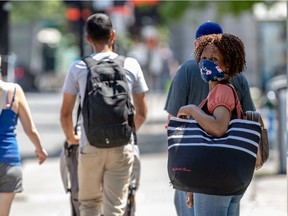 Montrealers wore masks in a heatwave in Montreal on Friday July 10, 2020. Dave Sidaway / Montreal Gazette
