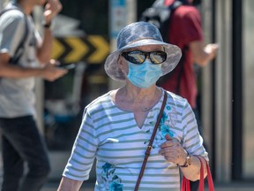 Montrealers wore masks in a heatwave in Montreal on Friday, July 10, 2020.