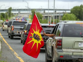 Mohawks of Kahnawake hold a rolling protest on July 11, 2020 to mark the 30th anniversary of the start of the Oka Crisis.