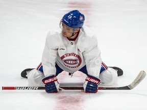 Canadiens' Max Domi stretches during practice at the Bell Sports Complex in Brossard on Thursday, July 23, 2020.
