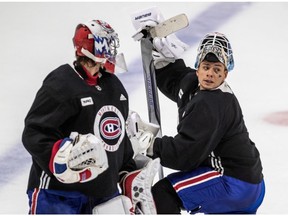 Canadiens goalies Charlie Lindgren (left) and Michael McNiven chat during practice at the Bell Sports Complex in Brossard on Thursday.