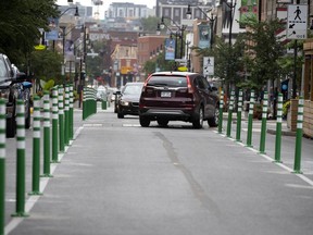 A motorist tries to get out of the way on Wednesday after realizing Notre-Dame St. had been turned in to a one-way street overnight with no signs advising motorists and residents.