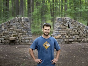 John Bland built his seven-foot-high wall after winning an art contest held to celebrate the 20th anniversary of the Association for the Protection of Angell Woods.